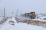 After a recrew, Q326 rolls through the heavy lake effect snow
